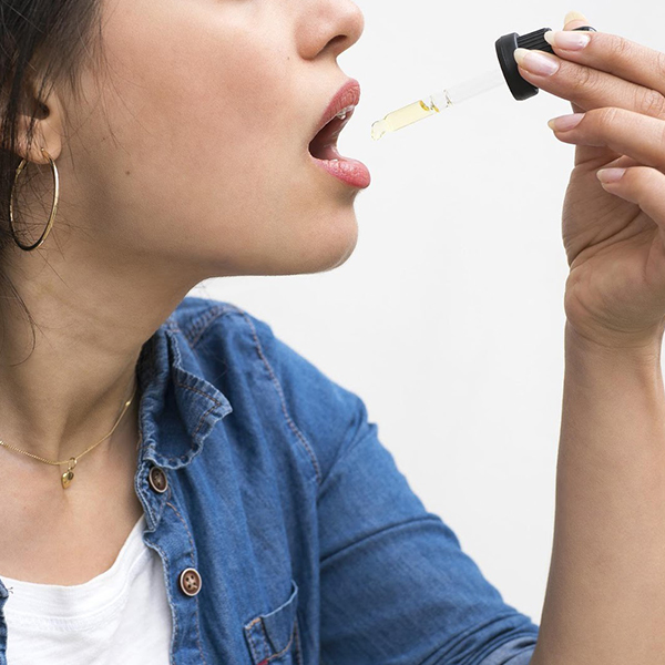 Woman Taking CBD