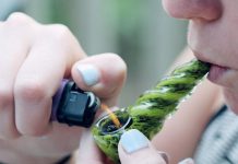 smoking herb in pipe