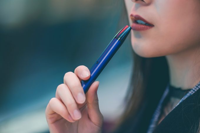 Woman Holding Vape