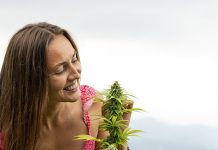 girl looking at cannabis