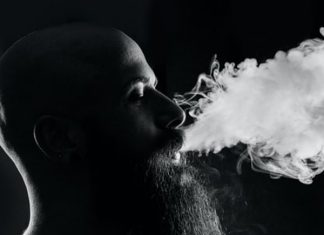bald man vaping