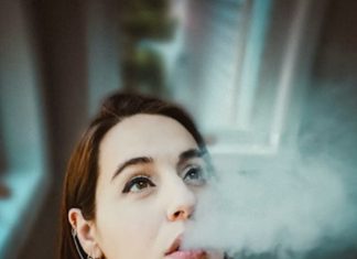 woman vaping looking up