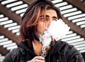 a man puffing a vape