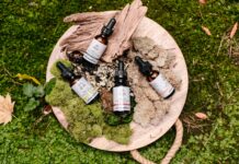 medicine bottles on green and brown moss